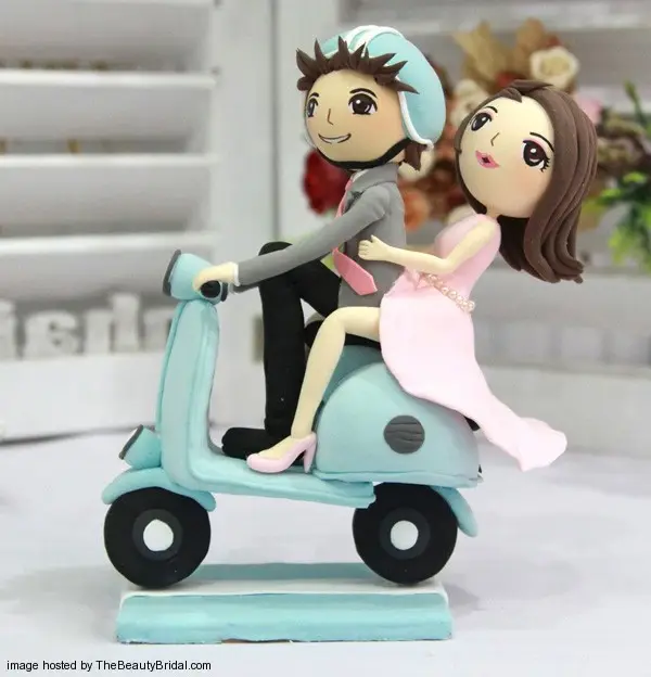 Bride and Groom on motorbike wedding cake topper