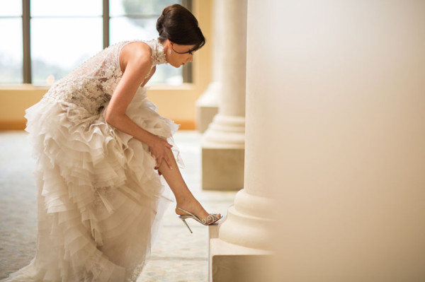 Bride in lace ruffle wedding gown photo 600x399 1