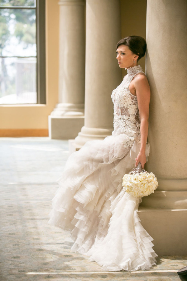 Bride in lace ruffles wedding gown with high neckline 600x900 1