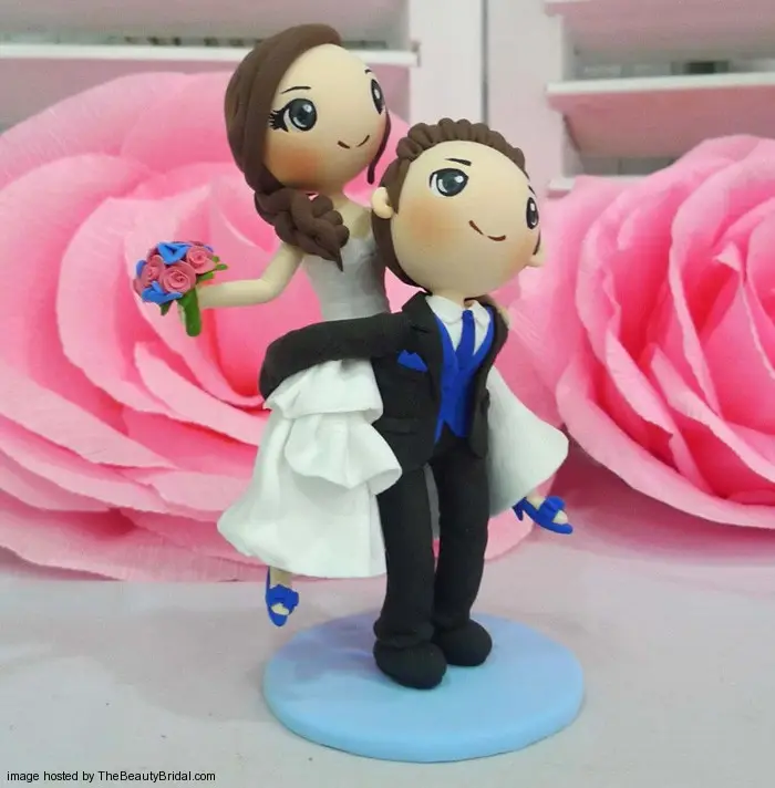 Groom carry bride on back clay doll wedding cake topper