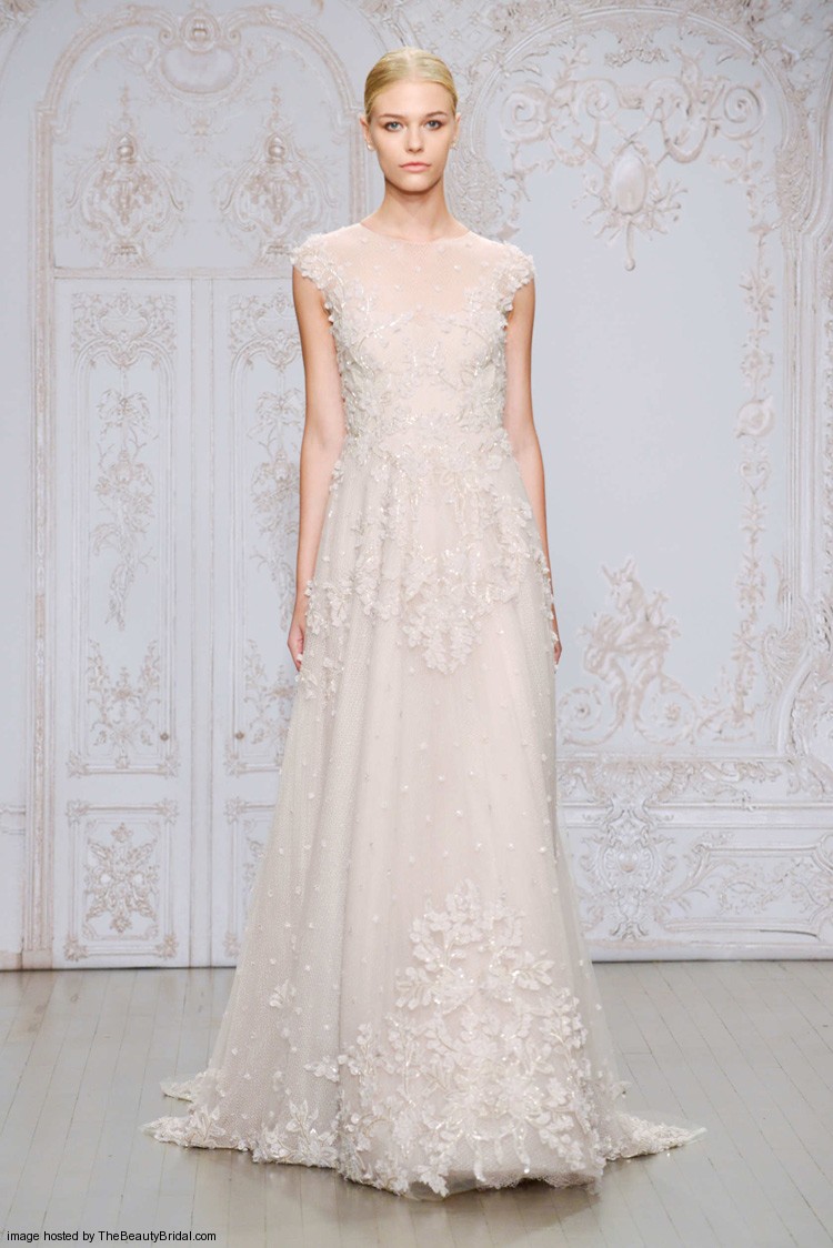 Monique Lhuillier Fall 2015 embellished lace and tulle A line blush wedding dress with an illusion high neckline and cap sleeves