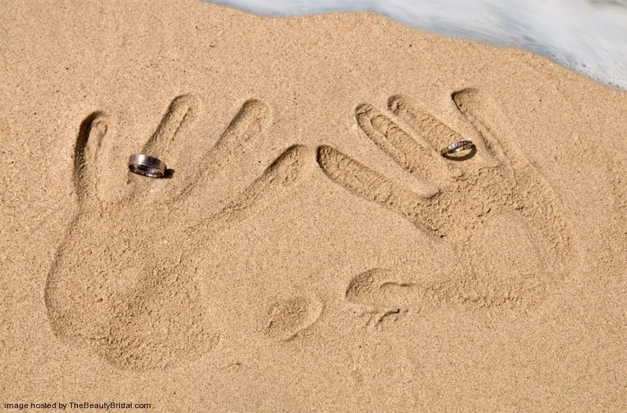 Wedding rings in the sand