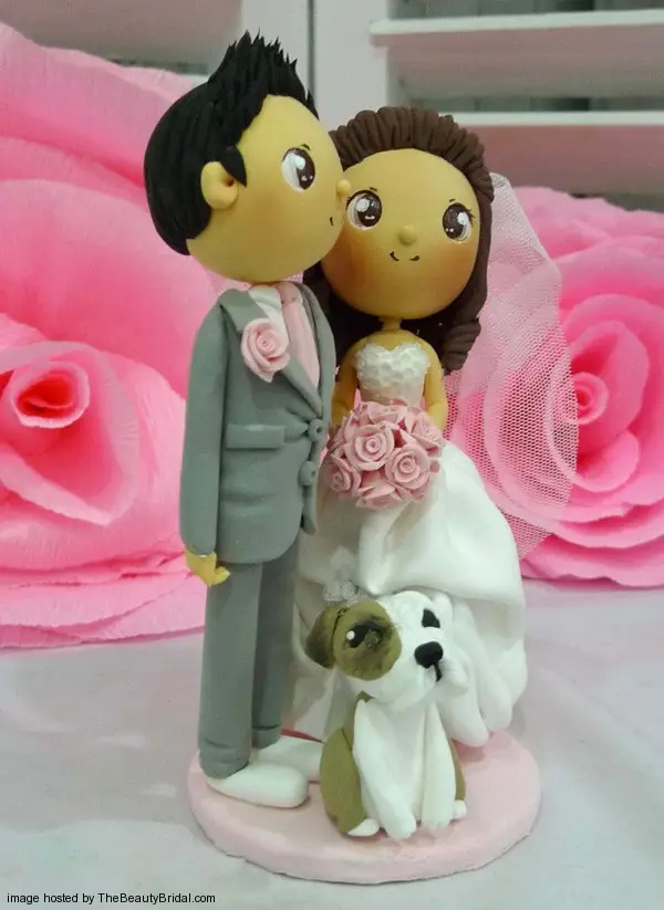 light pink wedding with cute puppy cake topper